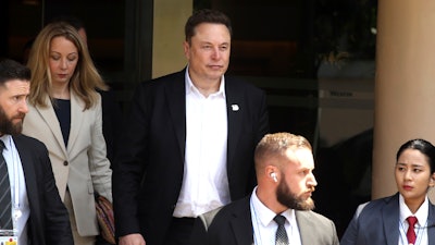 Elon Musk, center, arrives for the 10th World Water Forum in Nusa Dua, Bali, Indonesia on Monday, May 20, 2024.