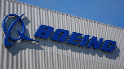 The Boeing logo is displayed at the company's factory Tuesday, Sept. 24, 2024, in Renton, Wash.
