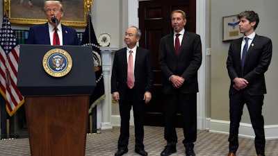 President Donald Trump speaks in the Roosevelt Room at the White House, Tuesday, Jan. 21, 2025, in Washington, as Softbank CEO Masayoshi Son, Oracle chief technology officer Larry Ellison and OpenAI CEO Sam Altman, listen.
