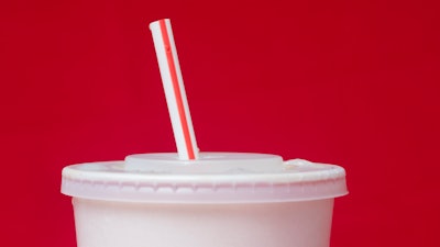 A large soft drink with a plastic straw from a McDonald's restaurant is shown in Surfside, Fla., May 24, 2018.