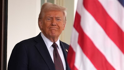 President Donald Trump stands before British Prime Minister Keir Starmer arrives at the White House, Thursday, Feb. 27, 2025, in Washington.