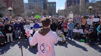 People listen to Griffin Gowdy, a PhD student at Columbia University, speak during a 'Stand Up for Science' rally in New York, Friday, March 7, 2025.