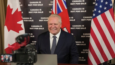 Ontario Premier Doug Ford prepares to speak to an American news outlet in his office at the Queens Park Legislature in Toronto on Monday, March 10, 2025.