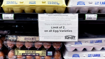A sign is mounted on a shelve of eggs at a grocery store in Northbrook, Ill., Feb. 28, 2025.