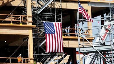 A construction crew works at a site in San Bruno, Calif., March 12, 2025.