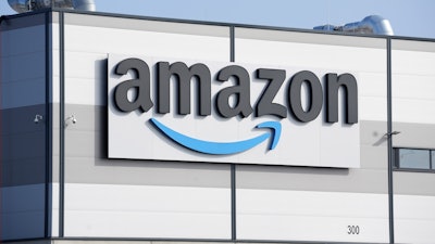 An Amazon company logo marks the facade of a building, March 18, 2022, in Schoenefeld near Berlin.