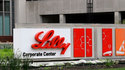 This April 26, 2017, file photo shows the Eli Lilly and Co. corporate headquarters in Indianapolis. Eli Lilly is offering a half-price version of its top-selling insulin Humalog as drugmakers face growing pressure to control prices. The drugmaker says it will introduce a version of the diabetes treatment called Insulin Lispro with a list price 50 percent lower than its current rate, about $275 per vial.