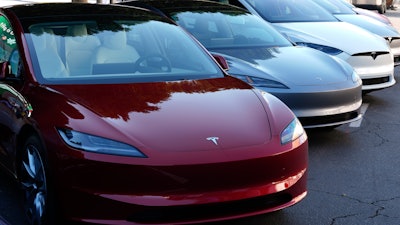 Tesla vehicles are displayed at the AutoMobility LA Auto Show, Thursday, Nov. 21, 2024, in Los Angeles.