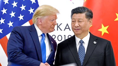 President Donald Trump, left, shakes hands with China's President Xi Jinping during a meeting on the sidelines of the G-20 summit in Osaka, Japan, June 29, 2019.