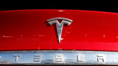The Tesla logo appears on an unsold 2020 Model X at a dealership, Feb. 2, 2020, in Littleton, Colo.